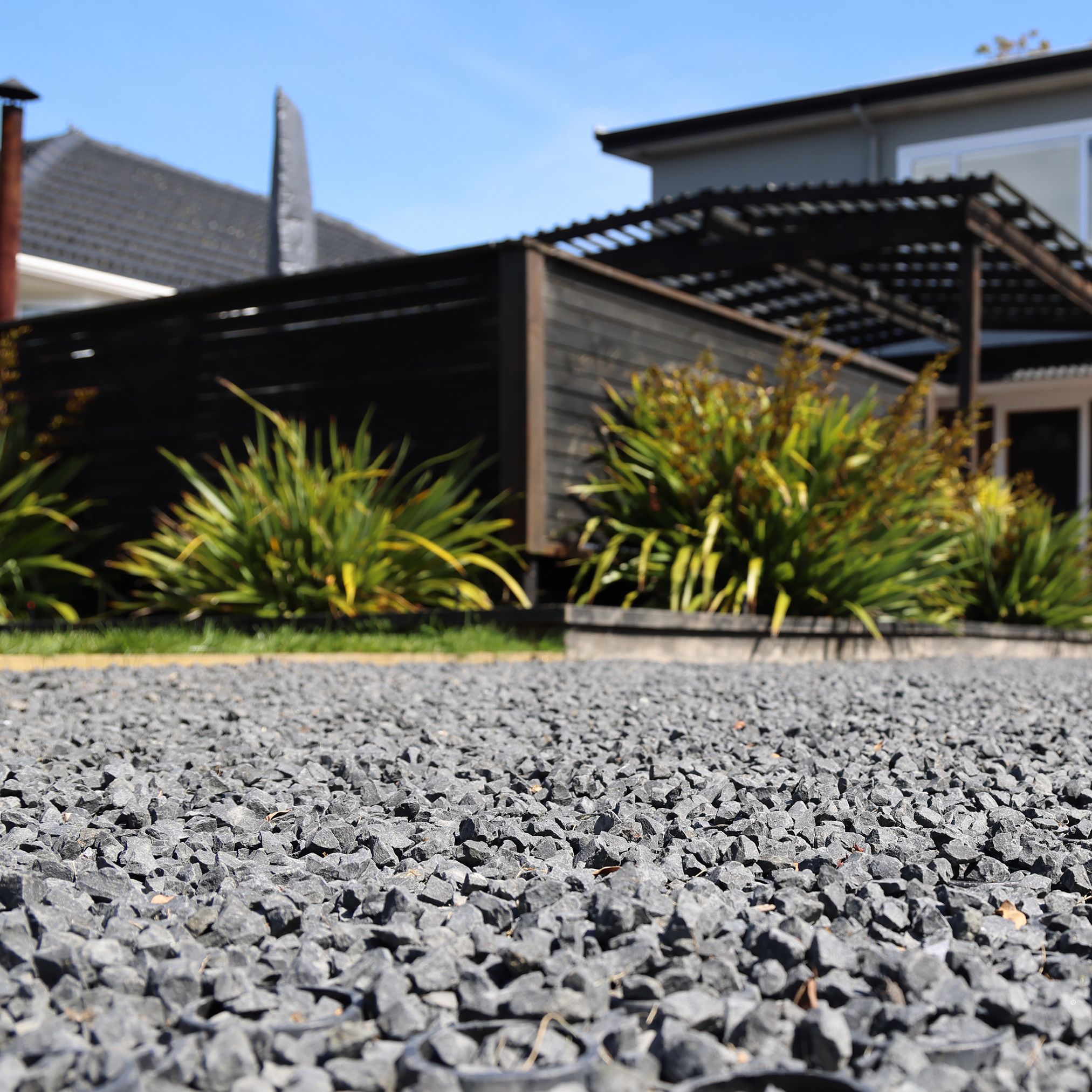 Permeable paved driveway leading to a home
